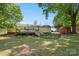 View of the home and backyard, featuring a deck with outdoor furniture and fenced in area at 2115 Fowler Secrest Rd, Monroe, NC 28110