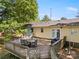 Well-maintained wooden deck with outdoor seating, umbrella, and a grill, perfect for outdoor entertaining at 2115 Fowler Secrest Rd, Monroe, NC 28110