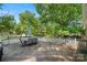 Spacious wooden deck features an umbrella, dining table, and grill, providing an inviting outdoor living area at 2115 Fowler Secrest Rd, Monroe, NC 28110