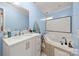 Bathroom with a modern vanity and sink, framed mirror, and a relaxing jacuzzi tub at 2115 Fowler Secrest Rd, Monroe, NC 28110