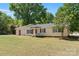 Inviting single story home featuring a classic porch swing and a well-manicured front yard at 2115 Fowler Secrest Rd, Monroe, NC 28110