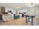 Spacious kitchen featuring white cabinets, a center island, and a dining area with table and chairs at 2115 Fowler Secrest Rd, Monroe, NC 28110