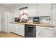Charming kitchen features stainless steel appliances, white cabinets, and a functional layout at 2115 Fowler Secrest Rd, Monroe, NC 28110