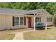 Inviting porch with a charming swing, creating a cozy and welcoming entrance to the home at 2115 Fowler Secrest Rd, Monroe, NC 28110