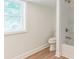 Clean bathroom with a shower-tub combo and vinyl flooring offers functionality at 221 N Davis Ave, Newton, NC 28658