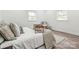 Bright bedroom featuring hardwood floors, neutral walls, and natural light from the double windows at 221 N Davis Ave, Newton, NC 28658