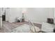 Clean bedroom featuring hardwood floors, neutral walls, and a comfortable sitting area at 221 N Davis Ave, Newton, NC 28658