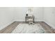 Bright bedroom featuring hardwood floors, neutral walls, and a stylish desk at 221 N Davis Ave, Newton, NC 28658