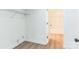 Small closet with vinyl flooring, wire rack, and an entrance to the bathroom at 221 N Davis Ave, Newton, NC 28658