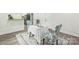 Cozy dining area with a table, two chairs, and an open view to the kitchen at 221 N Davis Ave, Newton, NC 28658