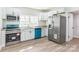 Bright, modern kitchen with stainless steel appliances, ample counter space, and stylish cabinets at 221 N Davis Ave, Newton, NC 28658