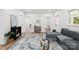 Spacious living room with multiple doorways and contemporary furnishings at 221 N Davis Ave, Newton, NC 28658