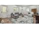 Inviting living room showcasing a grey sectional sofa and natural light at 221 N Davis Ave, Newton, NC 28658