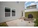 A view of a concrete patio in a home's backyard with an outdoor grill for entertainment at 244 Aershire Ct, Concord, NC 28025
