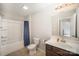 The bathroom has a shower and tub combo with modern fixtures and an elegant vanity at 244 Aershire Ct, Concord, NC 28025