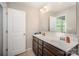 Bathroom featuring a double vanity and a large mirror with views into the bedroom at 244 Aershire Ct, Concord, NC 28025