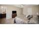 View of the bedroom with a TV on a dresser and a partial view into the attached bathroom at 244 Aershire Ct, Concord, NC 28025