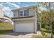 Two-story home with vinyl siding, a two-car garage, and a well-manicured lawn and landscaping at 244 Aershire Ct, Concord, NC 28025