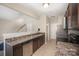 Charming kitchen featuring wood cabinets, stainless steel appliances, and laminate countertops at 244 Aershire Ct, Concord, NC 28025