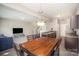 Open layout connecting the dining area, kitchen with stainless appliances, and living room at 244 Aershire Ct, Concord, NC 28025