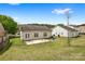 A spacious backyard with a concrete patio and well-maintained lawn offers outdoor living at 2659 Captains Watch Ne Rd, Kannapolis, NC 28083