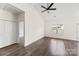 Bright bedroom with wood-look flooring, natural light, and a ceiling fan at 2659 Captains Watch Ne Rd, Kannapolis, NC 28083