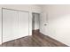 Bedroom featuring wood floors and a closet with bi-fold doors at 2659 Captains Watch Ne Rd, Kannapolis, NC 28083