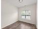 Bedroom with natural light from the window, wood floors, and minimalist design at 2659 Captains Watch Ne Rd, Kannapolis, NC 28083
