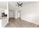 Open-concept space featuring wood-look flooring and modern ceiling fan at 2659 Captains Watch Ne Rd, Kannapolis, NC 28083
