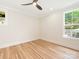 Inviting bedroom with gleaming hardwood floors and plenty of natural light from the windows at 2909 Hanson Dr, Charlotte, NC 28207