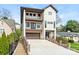 Stunning three-story home with a brick facade and multiple balconies at 2909 Hanson Dr, Charlotte, NC 28207