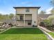 Rear view of the house with spacious yard, balcony and brick architecture at 2909 Hanson Dr, Charlotte, NC 28207