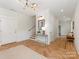 Bright entryway with stylish herringbone floors, a modern light fixture, and neutral décor at 2909 Hanson Dr, Charlotte, NC 28207