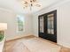 Elegant foyer features stylish herringbone floors, a modern light fixture, and a spacious layout at 2909 Hanson Dr, Charlotte, NC 28207