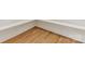 Close-up showcasing hardwood flooring with white baseboards in a home's corner at 2909 Hanson Dr, Charlotte, NC 28207