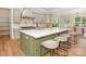 Bright kitchen with stainless steel appliances, large island with bar seating, and modern finishes at 2909 Hanson Dr, Charlotte, NC 28207