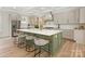Large kitchen island with seating, stainless steel appliances, and a modern, neutral color scheme at 2909 Hanson Dr, Charlotte, NC 28207