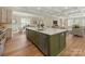 Bright, open kitchen with island seating, stainless steel appliances, and views to dining and living area at 2909 Hanson Dr, Charlotte, NC 28207