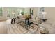 Bright living room with a neutral palette, large windows, and a modern coffee table on a patterned rug at 2909 Hanson Dr, Charlotte, NC 28207