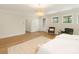 Spacious main bedroom featuring hardwood floors, neutral tones, and ample natural light at 2909 Hanson Dr, Charlotte, NC 28207