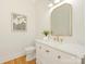 Bright powder room with a decorative mirror, elegant vanity, and stylish fixtures at 2909 Hanson Dr, Charlotte, NC 28207