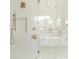 Modern shower area with glass door, rain shower head, tile surround, and built in niche at 2909 Hanson Dr, Charlotte, NC 28207