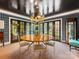 Elegant dining room features designer wallpaper, modern lighting fixture, and stylish decor at 2912 Wheelock Rd, Charlotte, NC 28211