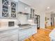 Chef's kitchen features light blue appliances, marble countertops, and sleek white cabinets at 2912 Wheelock Rd, Charlotte, NC 28211