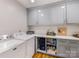 Bright laundry room features modern appliances, lots of storage and countertop space at 2912 Wheelock Rd, Charlotte, NC 28211