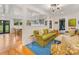 Open-concept living area with a view of the kitchen, featuring stylish decor and modern design at 2912 Wheelock Rd, Charlotte, NC 28211