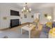 Cozy living room with a fireplace, stylish furnishings, and elegant decor with hardwood floors at 2912 Wheelock Rd, Charlotte, NC 28211