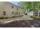 Exterior view of backyard with a shed and mature trees at 2915 Cross Country Rd, Charlotte, NC 28270
