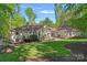 Expansive backyard featuring a well-manicured lawn, a patio and mature trees offering privacy at 2915 Cross Country Rd, Charlotte, NC 28270