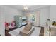 Cozy bedroom with bunk beds, a comfy rug, and natural light from a large window at 2915 Cross Country Rd, Charlotte, NC 28270